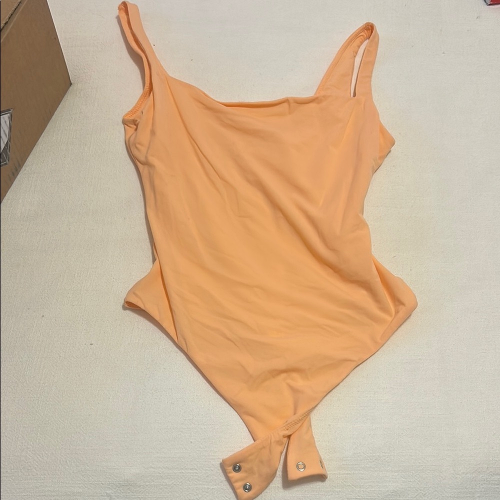SKIMS Peach One-Piece Bodysuit